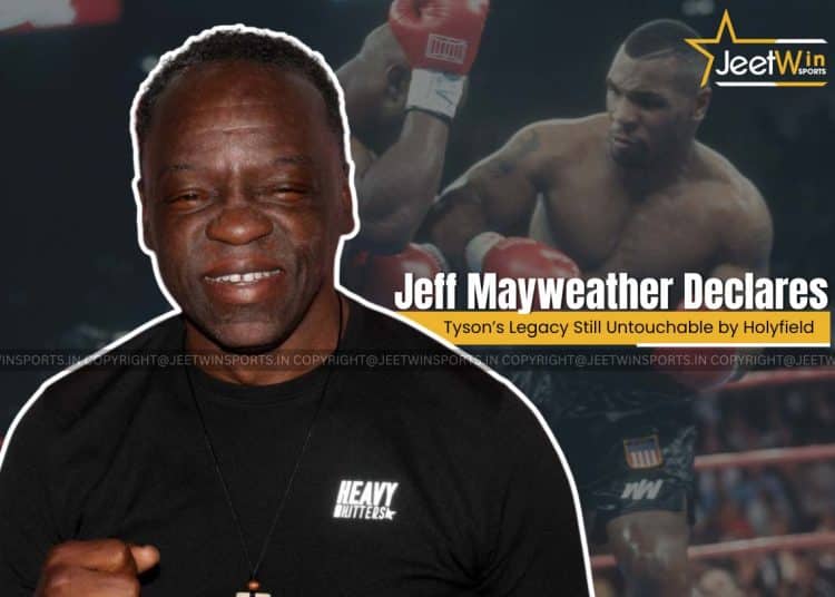 Holyfield on action in background