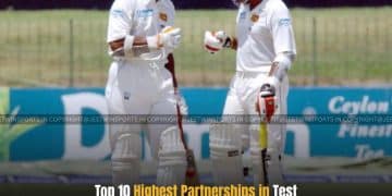 Two batsman on field discussing
