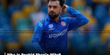 Rashid Khan scratching back of head on cricket fiend
