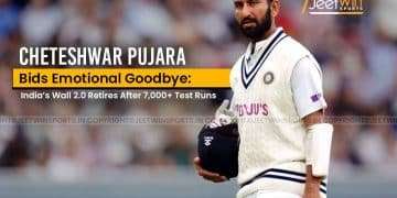 Cricketer Cheteshwar Pujara on the field carrying his helmet and bat