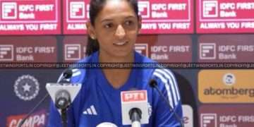 women cricketers with reporters