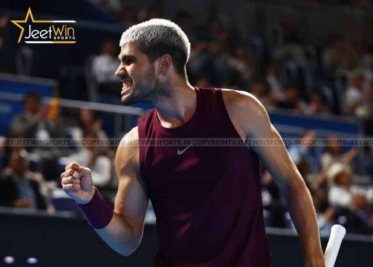 Tennis player celebrating happily on the court