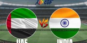 UAE and India flags displayed on a cricket field