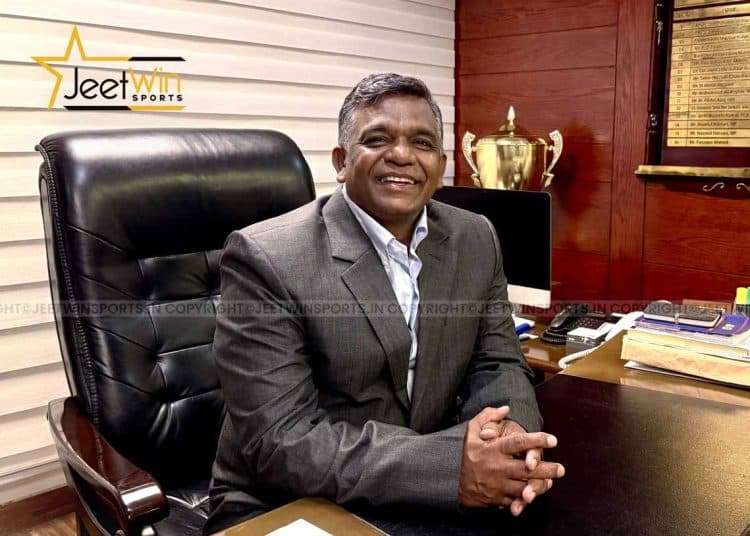 Man sitting in an office and smiling
