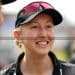 Woman wearing a cap and smiling