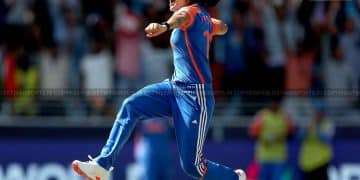 Women cricket players celebrating by jumping on the field during a match