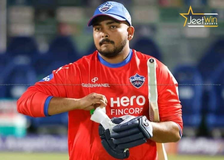 Prithvi Shaw Gets Another Chance as Delhi Capitals Re-Sign Him for ₹75 Lakh 1 Cricket player wearing gloves getting ready