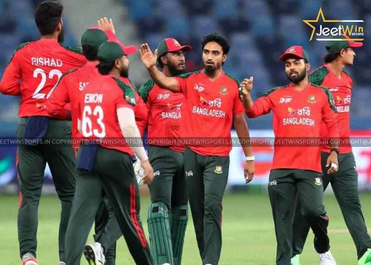 Cricket players gathering and high-fiving