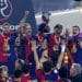Football team holding a trophy