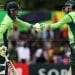 "Cricketers shaking hands during a match on the field