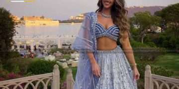 Woman in a lehenga posing for a photo